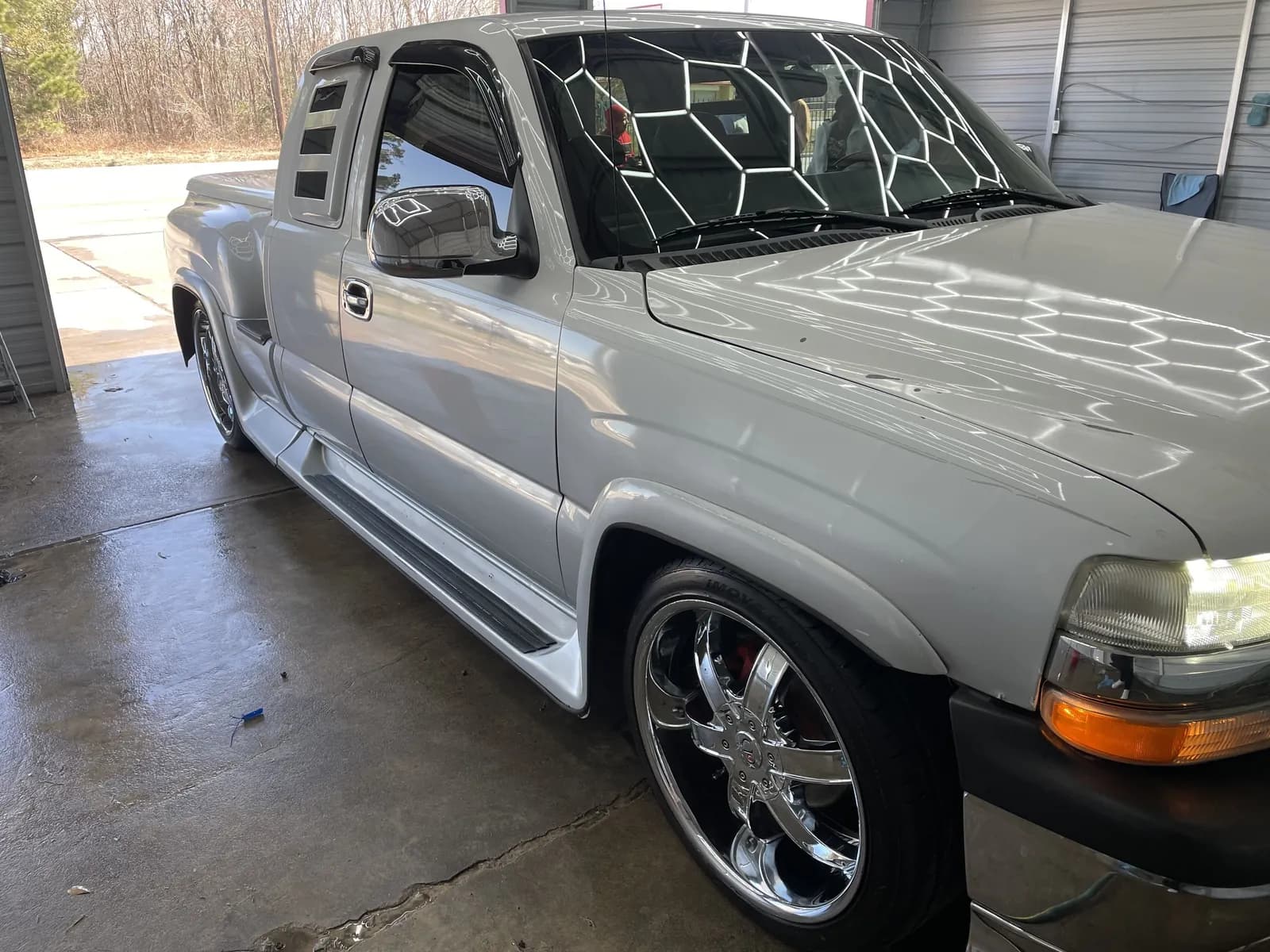 Custom Chevy dually on chrome wheels covered in soap patterns